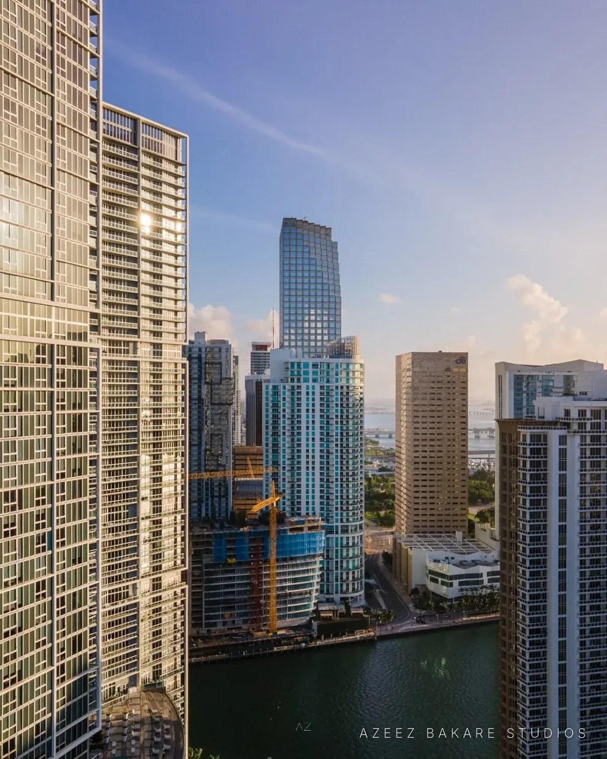 High-rise towers along a river in downtown Miami, architectural photograph by Azeez Bakare Studios